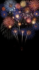 colorful fireworks exploding in night sky