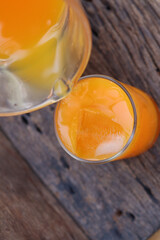 Soft drinks orange juice and iced in glass