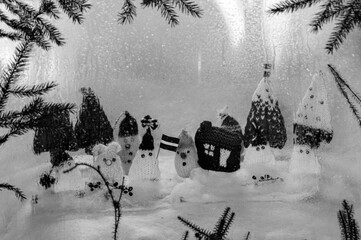 Christmas decorations from various knitted items, gnomes, snowmen, trees and houses, beautiful card, festive mood