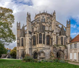 Fototapeta premium Bourges, France - 10 25 2025: Panoramic view of the exterior of the Saint Stephen's Cathedral rear building of Bourges with autumn colors