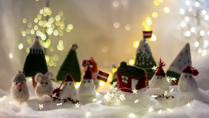 Christmas decorations from various knitted items, gnomes, snowmen, trees and houses, beautiful card, festive mood