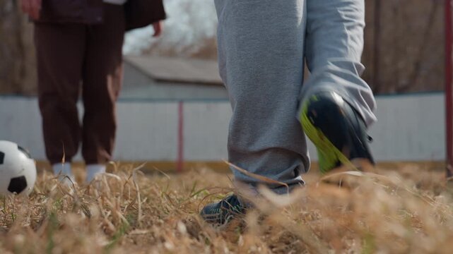 urban soccer intense, tense contest with attacker dodging defender amid gritty city environment, highstakes urban soccer clash where attacker skillfully evades defender in rugged urban landscape
