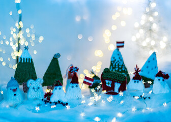 Christmas decorations from various knitted items, gnomes, snowmen, trees and houses, beautiful card, festive mood