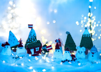 Christmas decorations from various knitted items, gnomes, snowmen, trees and houses, beautiful card, festive mood