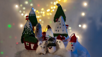 Christmas decorations from various knitted items, gnomes, snowmen, trees and houses, beautiful card, festive mood