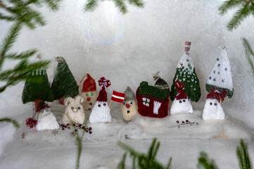 Christmas decorations from various knitted items, gnomes, snowmen, trees and houses, beautiful card, festive mood