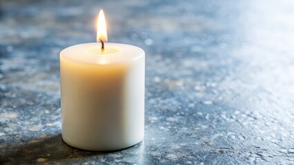 Single white candle on black background with soft flame