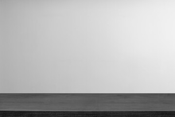 Empty wooden table top and color dark or gray wall background for showing products and advertisers....