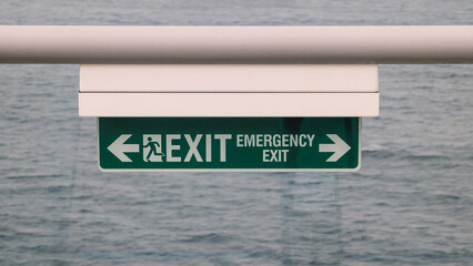 Close Up View Illuminated Green Exit Sign 