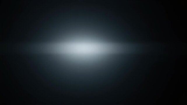 Soft, diffused light glows centrally on a dark background