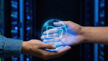 Hands holding glowing data folder globe in dark server room conveying secure digital file sharing and trust