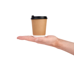 A hand holding a paper cup. The cup is brown and has a lid. The cup is not full
