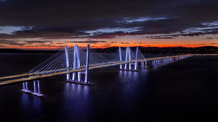 Obraz premium Distant night photo of the Mario M. Cuomo Bridge, spanning the Hudson River between Tarrytown and ... See More 