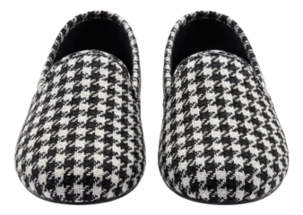 Black and white houndstooth patterned low-profile textile slippers.