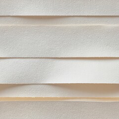 Abstract composition of stacked light-colored textured foam material