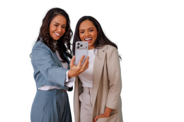 Two cheerful women friends making a selfie with a smartphone, showing happiness and connection with a transparent background