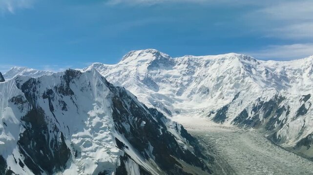 Snowy mountain and glacier drone shot. Jengish Chokusu, Victory Peak, Kyrgyzstan. Tian Shan mountains, awasome landscape, 4K