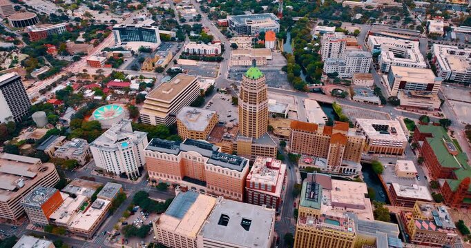 Rising over the urban landscape of San Antonio, Texas, USA with Life Tower Building in the center. Architecture of city downtown from drone footage.