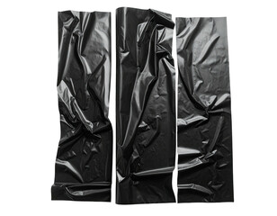 Black, textured plastic sheets arranged vertically. Shadows create depth and highlight folds. Abstract composition