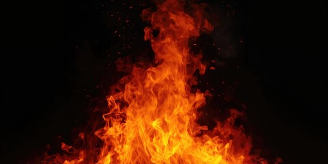 Obraz premium Bright orange flame burning fiercely on a dark backdrop, illustrating high temperature and energy, Earth Day