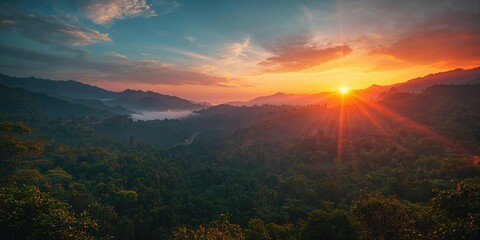 Morning light illuminating a lush tropical landscape with mountains and trees, ideal for eco-tourism, Earth Day