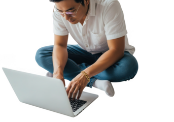 Man wearing glasses and jeans working on a laptop computer isolated on transparent background