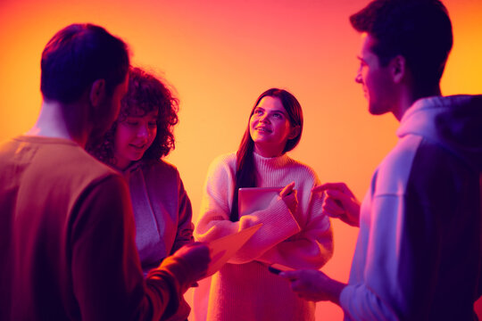 Team presenting digital information to each other. Concept of client meetings, service explanation, product presentation, business pitching and professional communication. - Powered by Adobe