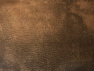 Brown textured leather background close up macro surface detail for luxury fashion design material