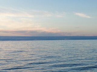 Calm sea, clouds on the horizon
