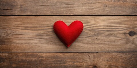 Red felt heart on vintage wood surface designed for Valentine's Day message, suitable as a card background