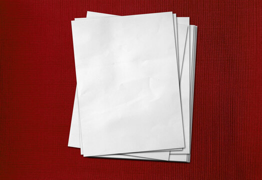 Blank Stack of A4 White Printer Paper Sheets placed on red fabric wallpaper background | Empty Clean Office Documentation Mockup with Copy Space for Text and Design.