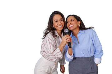 Happy female friends singing karaoke together, enjoying a fun night out, sharing moments of joy in...