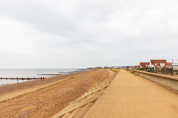 Heacham Beach, Heacham, Norfolk. Coastal beachfront pathway along a quiet seaside town with houses