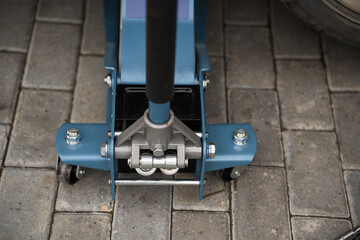 Fototapeta premium Rolling jack under the car