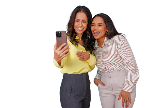 Two happy women friends smiling and laughing, taking a selfie with a smartphone, sharing fun time, transparent background - Powered by Adobe