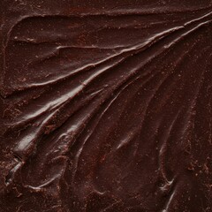 A detailed macro shot capturing the rich, uneven texture of solid dark cacao. Ideal gourmet food background or pattern ,culinary ,chocolate ,ingredient