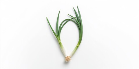 Fototapeta premium Fresh green onions placed on a white background, ideal for food styling or ingredient display, neutral setting