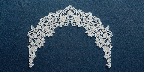 Lace embroidery pattern on denim surface, used as a background for layout or UI