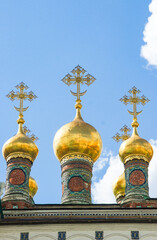 golden domes of a traditional Russian Orthodox church. Cathedral Domes crowned with ornate crosses. Aesthetic of Russian religious architecture. For travel brochures, cultural articles