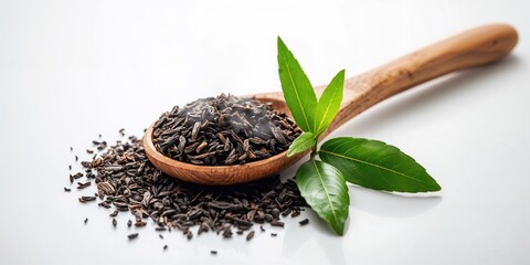 Black tea in a wooden spoon alongside fresh tea leaves, illustrating harvest and preparation, World Tea Day