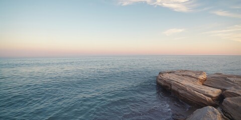 Sunlit rocks and ocean scene, shoreline stability concern, Earth Day