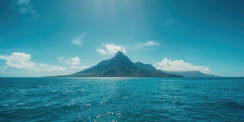 Tropical island landscape showing mountain and greenery, highlighting natural scenery in the Gambier Islands