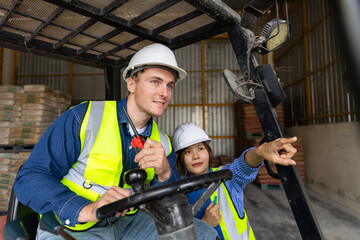 Professional construction workers coordinating material logistics and safety