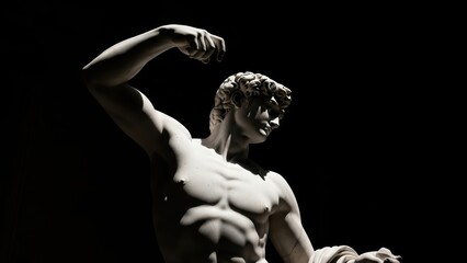 A dramatically lit classical statue of a muscular male figure against a black background.