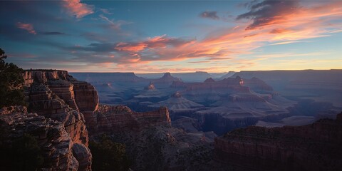 Grand Canyon at sunrise, showcasing stratified cliffs and the effects of seasonal weather on landscape