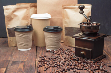 Coffee beans, mill, ground coffee on wooden table. Copyspace. Making coffee