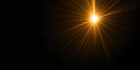 Golden sunlight lens flare on a dark background creating a warm glow, suitable for cinematic or artistic lighting