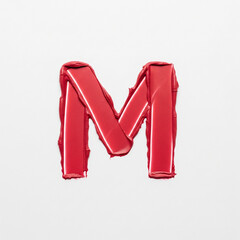 A bold, capital letter M drawn with a single, creamy lipstick stroke. Textural streaks and opacity variations reveal its sensual, physical creation against a stark, pure white background.