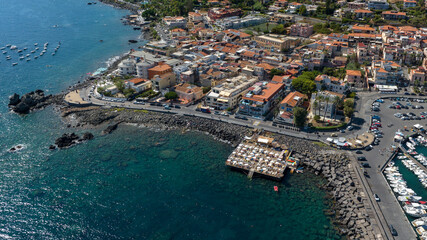 Aerial view of the Aci Trezza waterfront overlooking the Mediterranean Sea, in the province of...