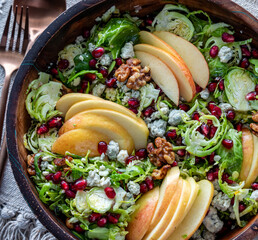 A close up look into a bowl of a freshly made Brussels Sprouts salad.